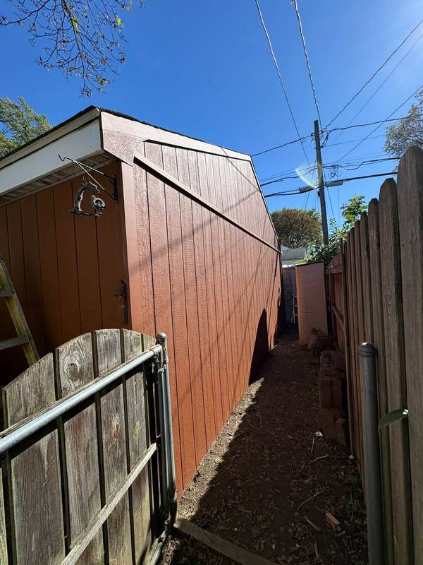Red-brown painted building side wall