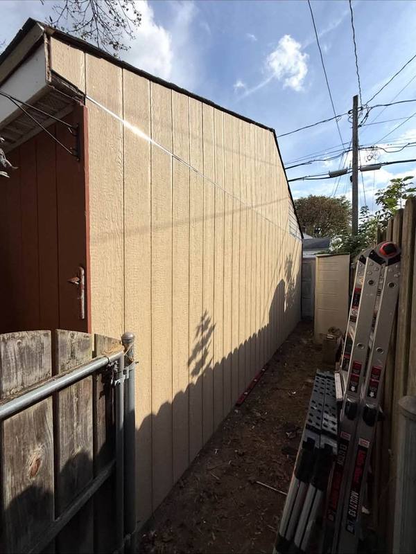 Tan painted exterior side wall of a building
