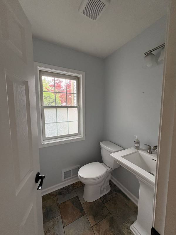 Small powder room painted light grey
